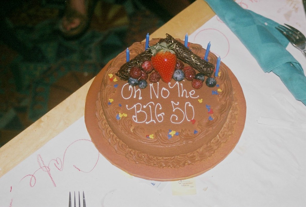 A birthday cake with lit candles