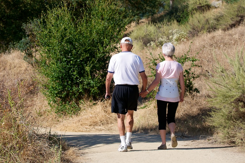 A couple walking together in a park